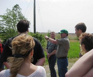 Coulterville resident and farmer points out coal slurry impoundments at Gateway Mine