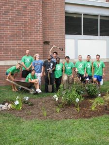 compressed students behind finished garden