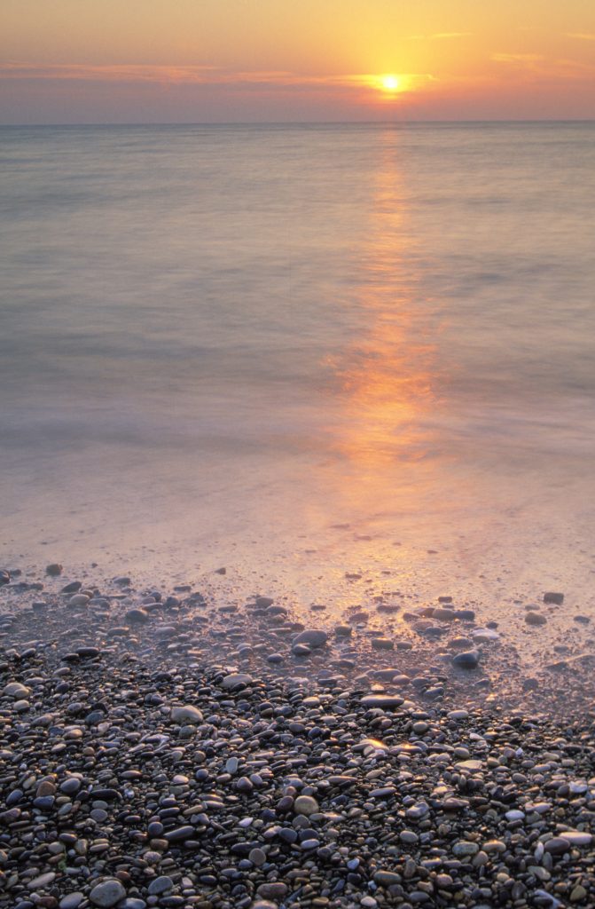 Sunrise over Lake Michigan and a beach at Illinois Beach State Park, Illinois