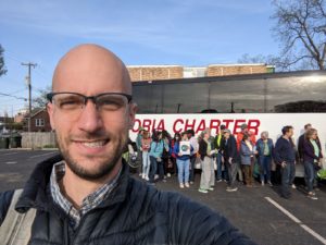PRN's Andrew Rehn poses with Environmental Lobby Day participants in the background awaiting the trip to Springfield